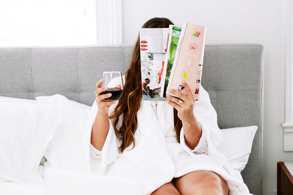 For your future self 7 - Woman in bed with magazine and glass of wine