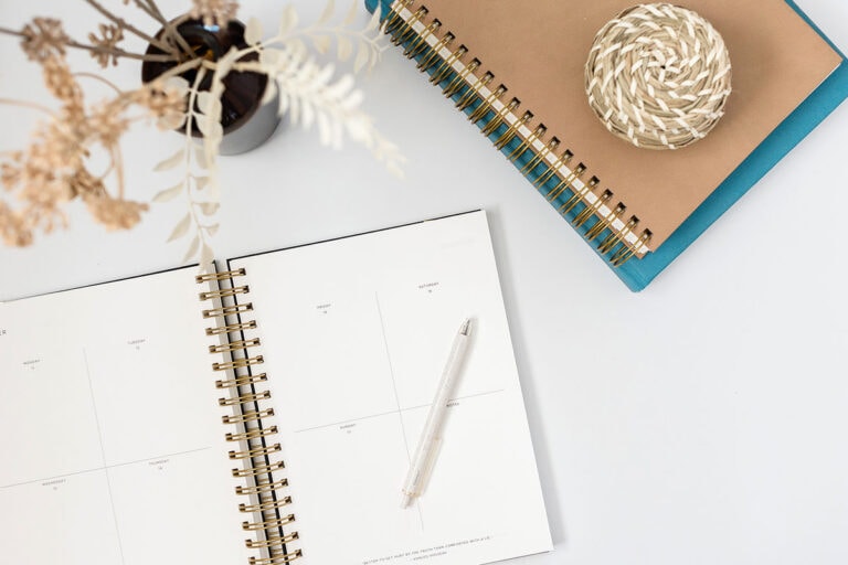 Monthly Routine 1 - Calendar and notebook on a desk